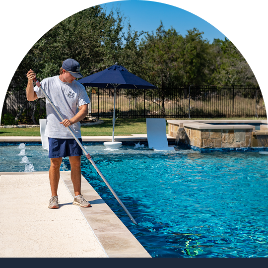 Person cleaning a pool
